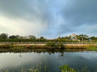 Obraz premium ,Scenic view of river amidst field in mountain against sky,Bridge over river against sky,Aerial view of river,View of hong kong harbor during foggy weather,