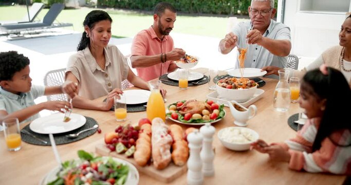 Food, help and happy with big family at lunch for bonding, nutrition and thanksgiving event. Health, social and holiday with people at table of dining room at home for love, celebration and brunch