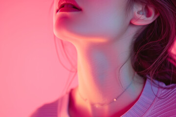 Close up female neck, collarbones isolated on pink studio background.