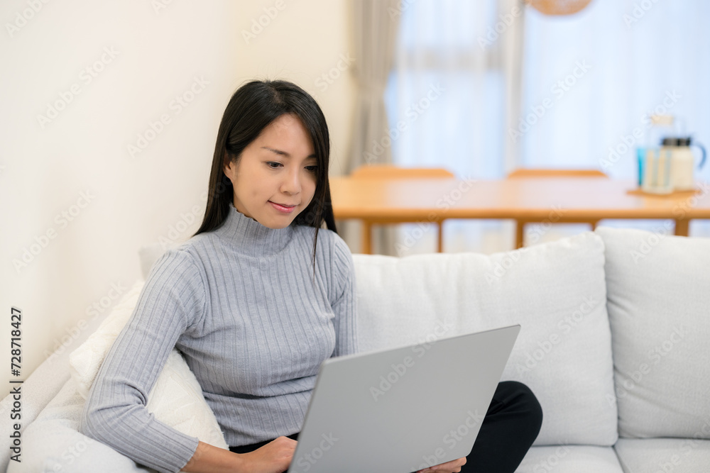 Wall mural woman work on laptop computer at home