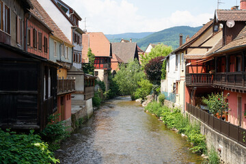Fototapeta na wymiar Kaysersberg-Vignoble historic Alsace town with traditional timbered houses above river, popular tourist destination in France