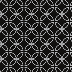 abstract seamless repeatable grey flower pattern on dark.