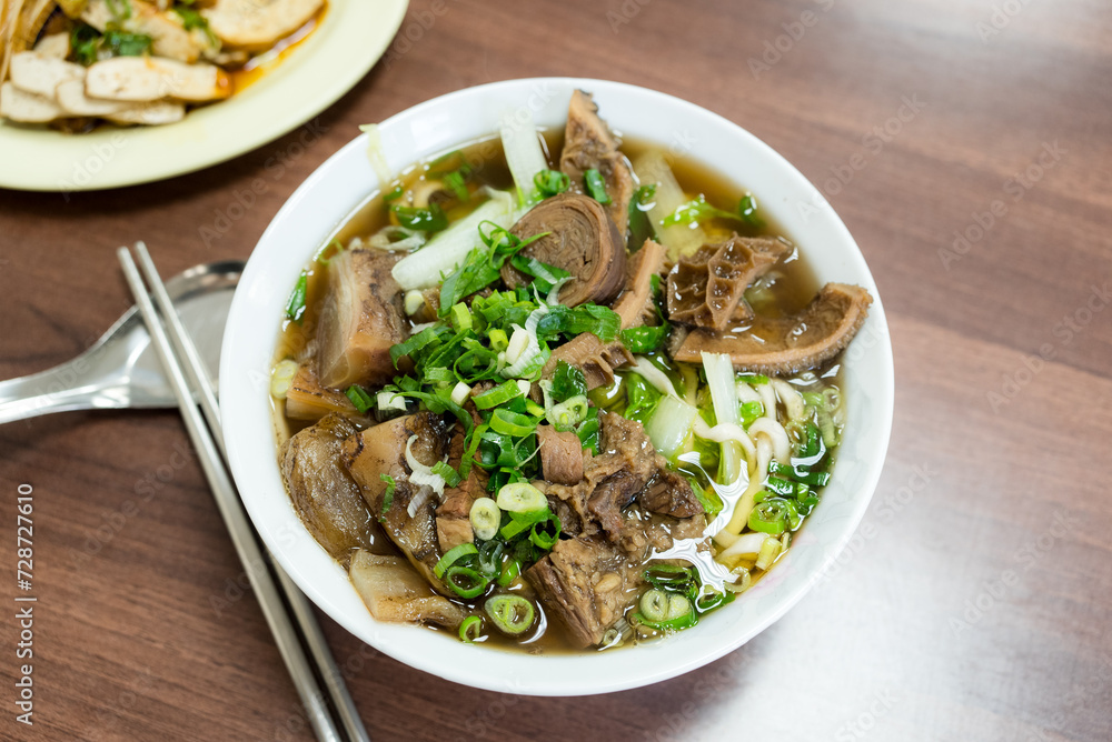 Poster braised beef noodle soup in restaurant