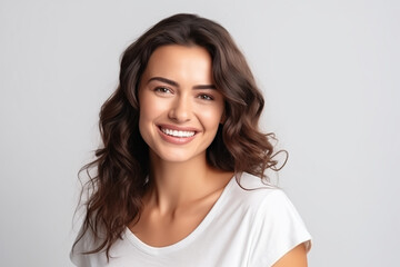 A photo portrait of a beautiful turkish woman over 30 years old, smiling with clean teeth, perfect teeth. To advertise dentistry, white background