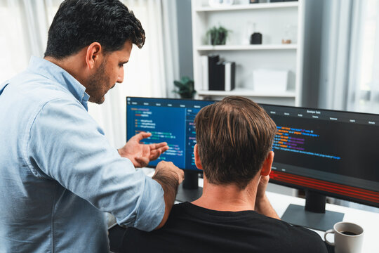 IT developers creating online software development information on screen laptop with coding program in data of application and website. Technical engineer coder on safety program concept. Sellable.