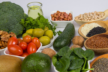a variety of vegetables including broccoli, nuts, and other foods