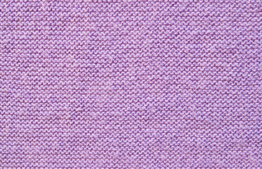 Soft purple color purl knit fabric pattern close up as background

