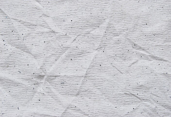 White wrinkled paper texture, a sheet of recycled creased white watercolor paper as background

