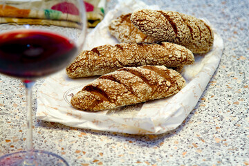 Mini Baguettes on the Table. Red Wine Glass