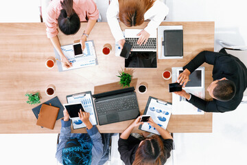 Top view of businessman executive in group meeting with other businessmen and businesswomen in...