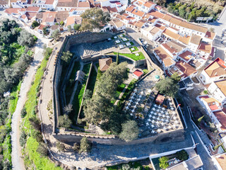 Aerial drone view of Alcoutim Castle (Castelo de Alcoutim) in the border town of Alcoutim, Algarve,...