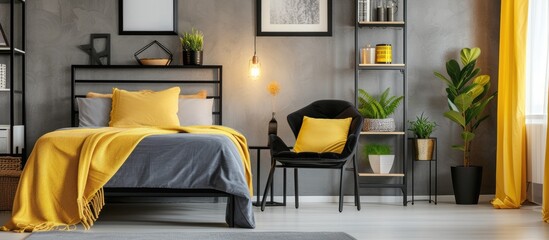 Spacious bedroom with yellow accessories featuring a sleek black chair next to a metal shelf and bed.