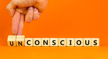 Conscious or unconscious symbol. Concept words Conscious Unconscious on wooden blocks. Beautiful...