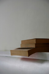 Old books on the bedhead in white background