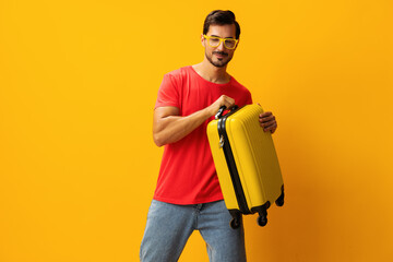 Baggage man trip studio yellow background traveler happy suitcase flight vacation travel weekend...