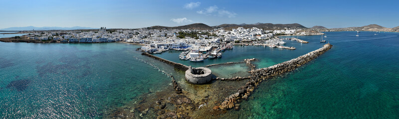 Aerial drone photo from picturesque small seaside village of Naoussa with traditional Cycladic...