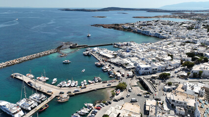Aerial drone photo from picturesque small seaside village of Naoussa with traditional Cycladic...