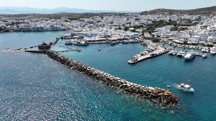 Aerial drone photo from picturesque small seaside village of Naoussa with traditional Cycladic...
