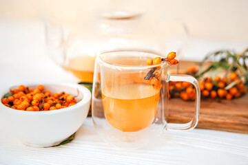 glass teapot filled with refreshing sea buckthorn tea