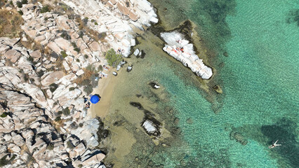 Aerial drone photo of famous small organised beach with unique rock formations of Kolimbithres or...