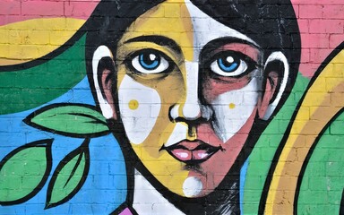 Detail of an anonymous street graffiti with many colors, cheerful urban background