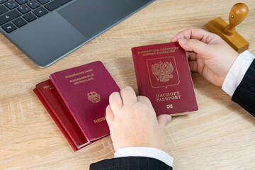 Close-up foreign passports of citizens of Germany, Russia, female border patrol officers...