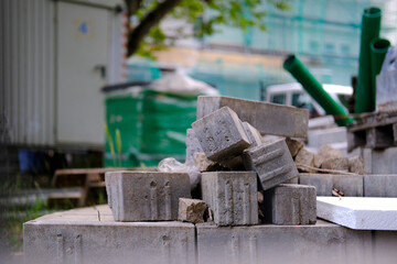 building materials on pallets, concrete blocks, chipboard sheets, construction and renovation...