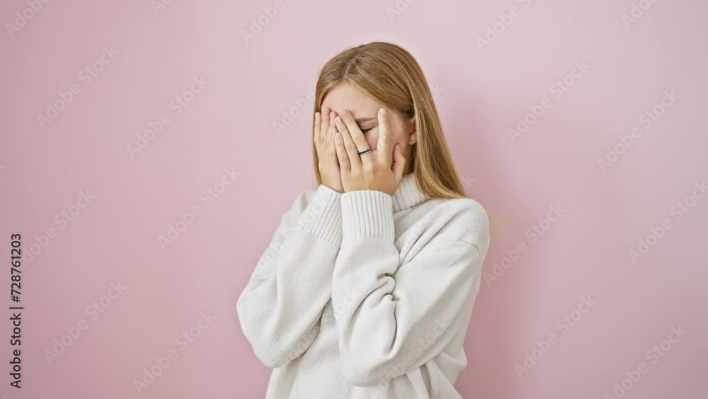 Poster depression concept, beautiful, ashamed blonde girl covering crying face with hands over isolated pin