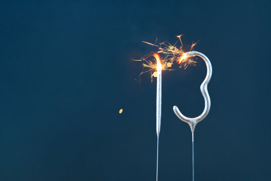 13 years celebration festive background made with Bengal fires in the form of number Thirteen.