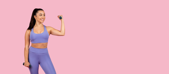 Happy woman lifting weights in purple fitness suit, panorama