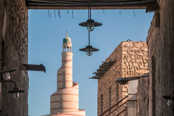 mosque tower view from old souq waqif market bazar - Doha , Qatar