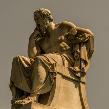 Sorates marble statue, the ancient Greek philosopher, isolated on plain sky background. Travel to Athens, Greece.