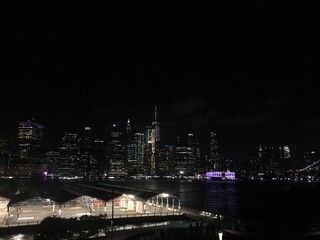 Fototapeta na wymiar From Brooklyn overviewing NY city lights.