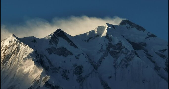 Aerial view of Mt Rakaposhi summit when the first light beams light it, Karakoram Range of the Himalayas, Hunza Valley,Pakistan