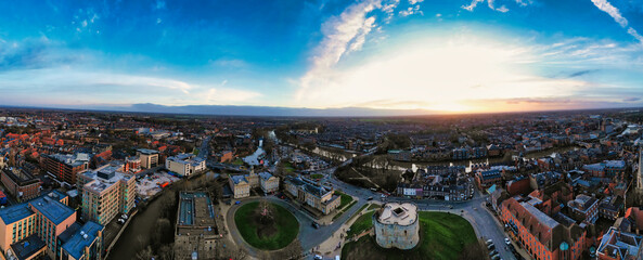 Panoramic aerial view of a city at sunset with dramatic sky and urban landscape in York, North...