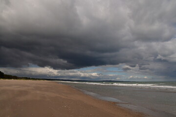 Fototapeta na wymiar Storm clouds over the forest in Ravent Point, Curracloe, County Wexford, Ireland