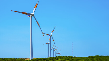 Wind generators on the highlands of Madeira island against the blue sky. Copy space.