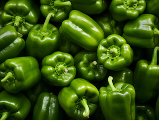 Top view background with ripe green bell peppers 