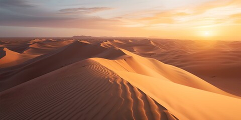 Fototapeta na wymiar Breathtaking desert sunset, golden sand dunes under warm light. serene nature landscape, perfect for background or wall art. peaceful, tranquil scene with space for text. AI