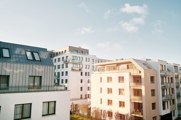 EU Modern European complex of apartment buildings and outdoor facilities. Condo exterior. White facade of a house.