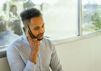 Businessman talking on the phone in the office.