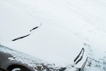 Winter Driving Tips: How to Clear Ice and Snow from a Car Windshield with a Scraper. Car exterior...