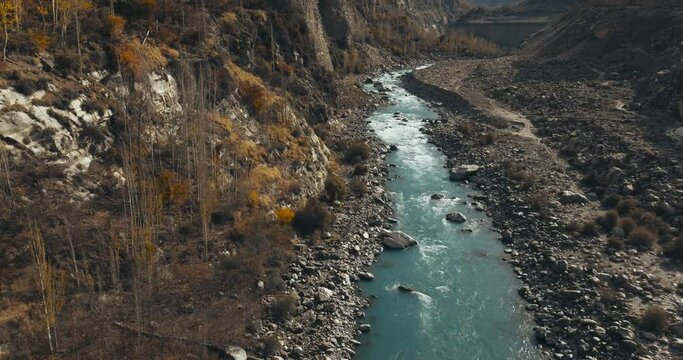 Aerial View of Hunza River surrounded by autumn colors, Hunza Valley, Himalayas, Paksitan