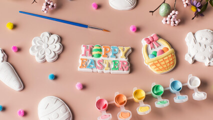 Easter figures made of plaster with paints, the concept of children's crafts for Easter.