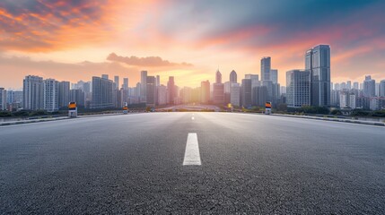 Empty asphalt road and modern city skyline with building scenery at sunset. high angle view