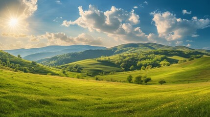 Fototapeta na wymiar panorama of beautiful countryside of romania. sunny afternoon. wonderful springtime landscape in mountains. grassy field and rolling hills. rural scenery