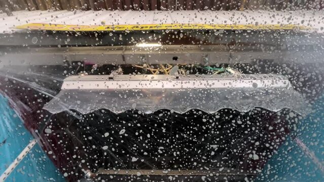 A driver's POV personal perspective going through an automatic car wash tunnel. Part 1 of 3.  	