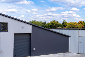 Modern house with garage and roof made of metal sheets.