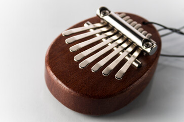 One small kalimba on a white background