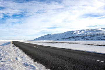 Road across country covered by snow, Iceland